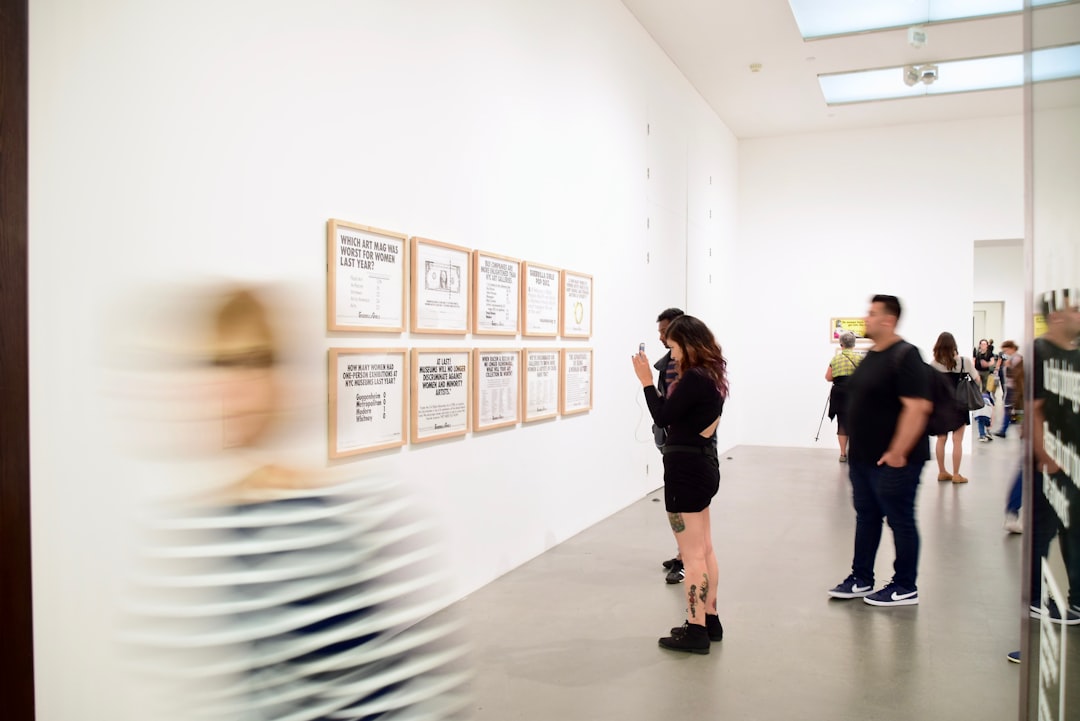 A young woman prepares her exhibition inside a gallery artist space on the Lower East Side of New York City