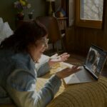 Woman starting a telehealth session with an NYC therapist